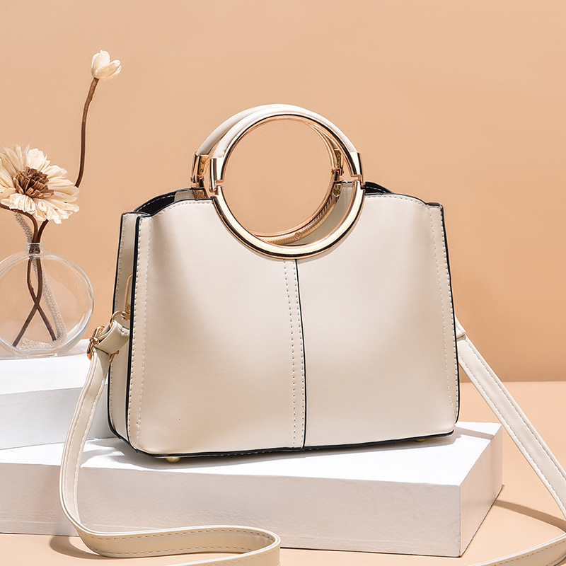 The new round handbag is a Korean version of a fashionable women's single-shoulder crossbody bag. It is simple, large-capacity and multi-layered for women full figure