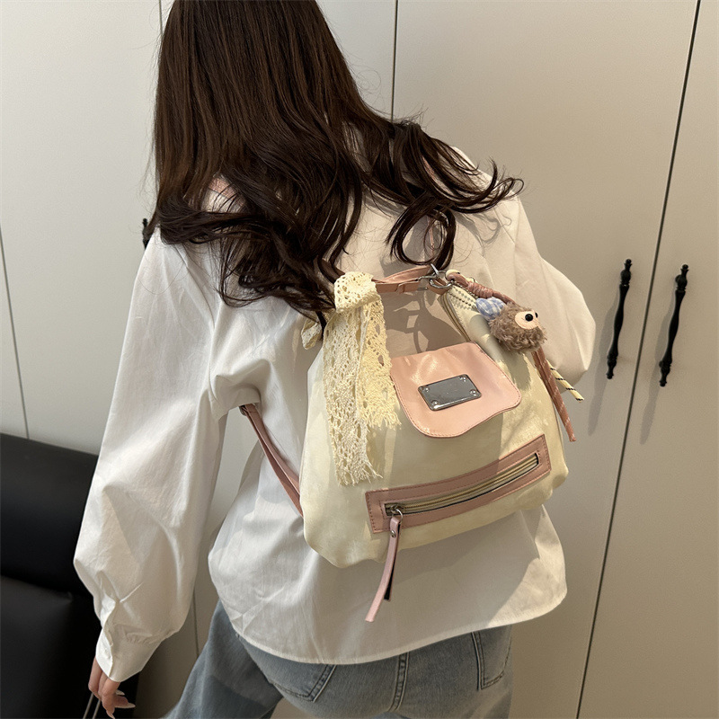 A trendy and niche design backpack with a new large-capacity multi-purpose tote bag for women, a light spring student single-shoulder bag Application Scenario
