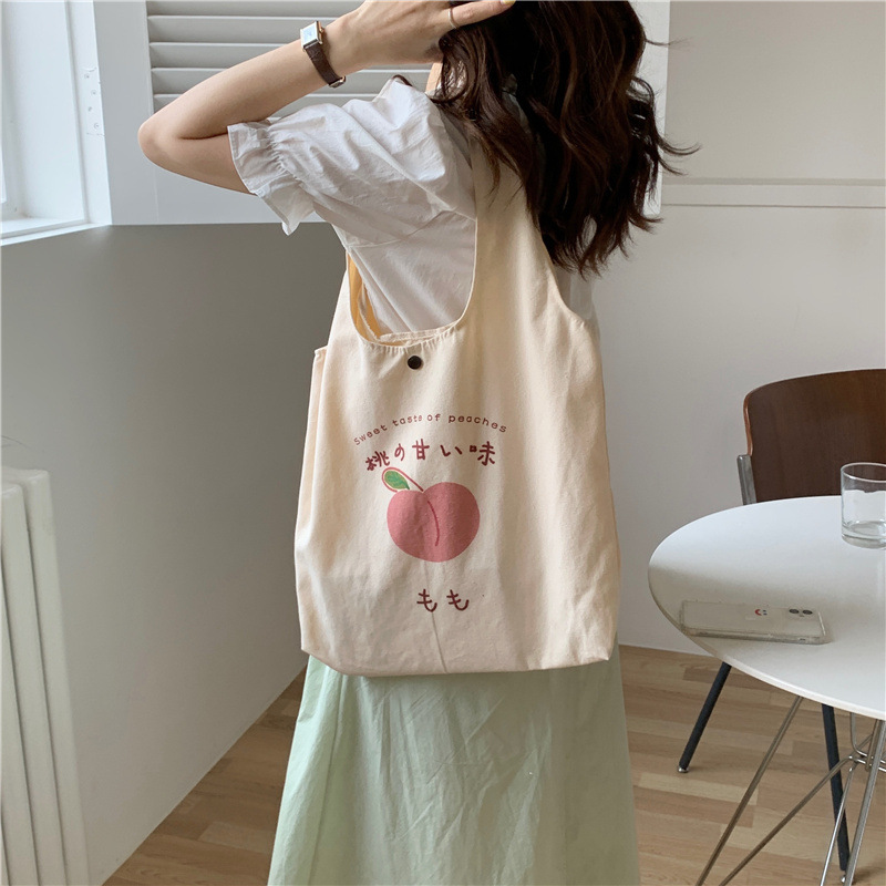 【 In Stock 】1552 canvas bag for Girls, a fresh and cute peach-printed single-shoulder bag, a Japanese college student schoolbag details Picture