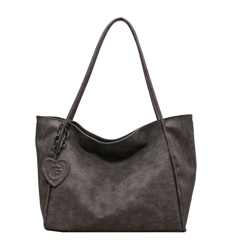 A new retro and simple single-shoulder bag with a large capacity for women in 2025, featuring a high-end texture. It is a tote bag for both class and casual commuting Item Picture