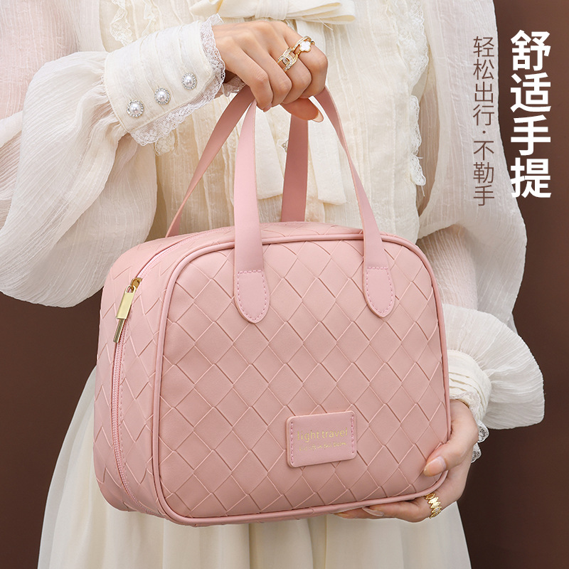 New high-appearation-level makeup bag, travel woven pattern, cream, large capacity, hand-held, half-curved cosmetics, washroom storage full figure