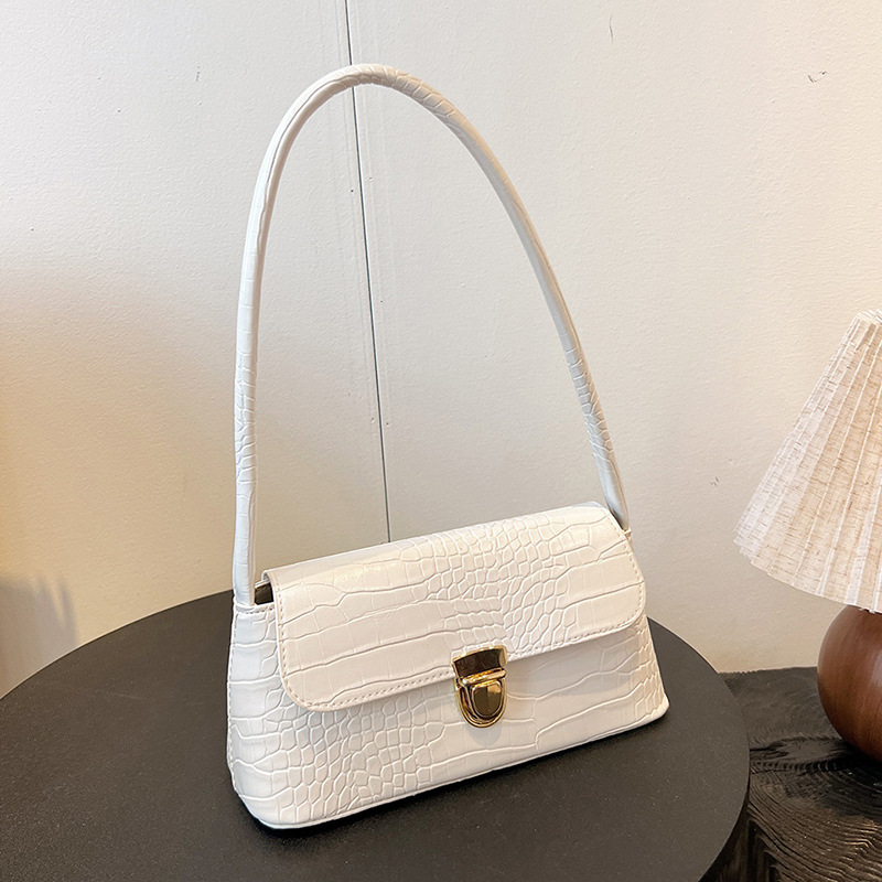 In the autumn of 2024, the crocodile-patterned baguette bag is a fashionable and high-quality hand-held women's bag and a single-shoulder armpit bag for commuting full figure