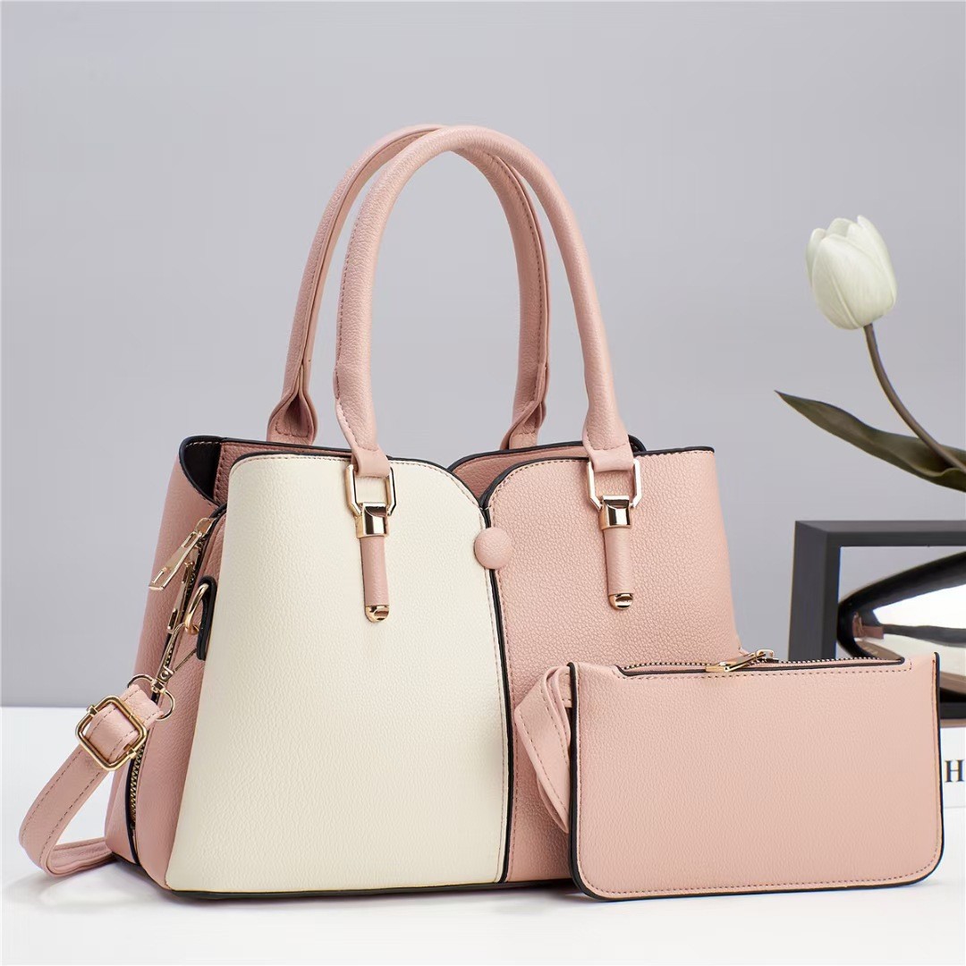 The new large-capacity, color-blocking hand-held mom bag for women in the autumn and winter of 2024 is a trendy and fashionable single-shoulder crossbody bag full figure