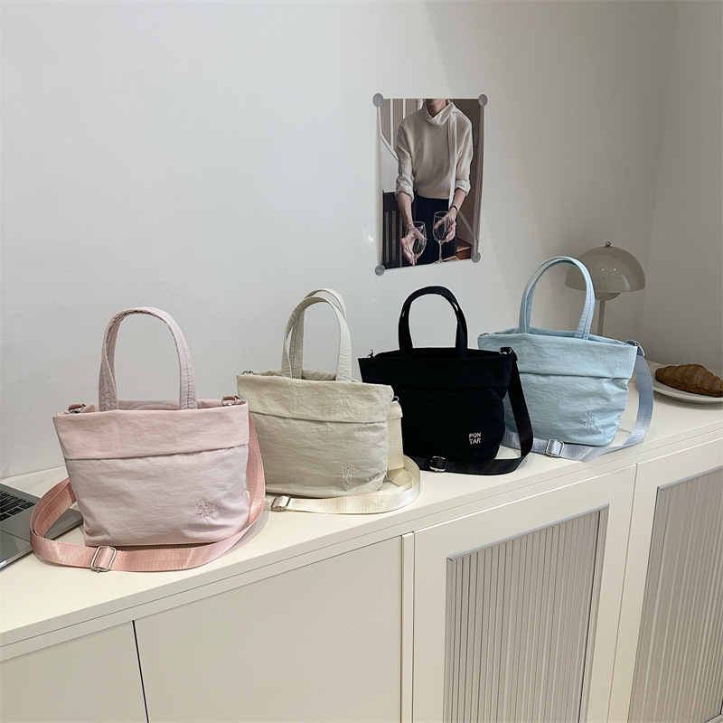 Simple nylon fabric bag for women, 2025 new style fashionable Korean version hand-held tote bag, versatile single-shoulder crossbody bag Application Scenario