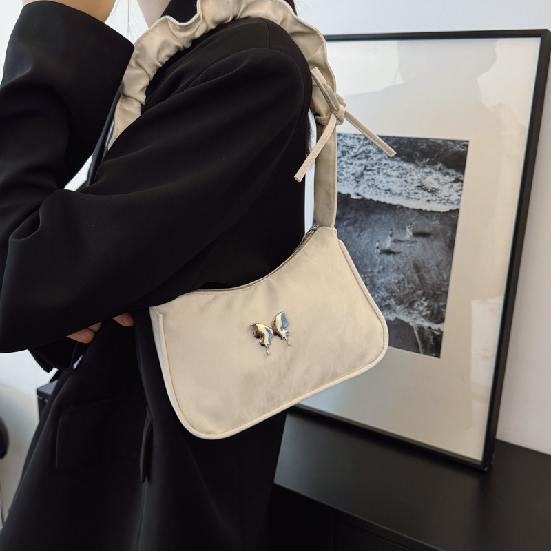The popular solid-color bow underarm bag 2025 new style simple and casual handbag with pleated, stylish and fashionable shoulder bag details Picture