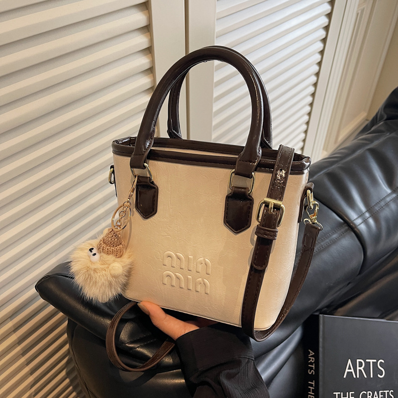 High-end and trendy hand-held bucket bag, new Korean style fashionable single-shoulder bag 2025, niche design casual crossbody bag full figure