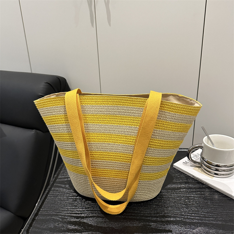 Large-capacity hand-held straw woven bag, new striped tote bag, woven bag, vacation-style beach bag, versatile women's bag full figure
