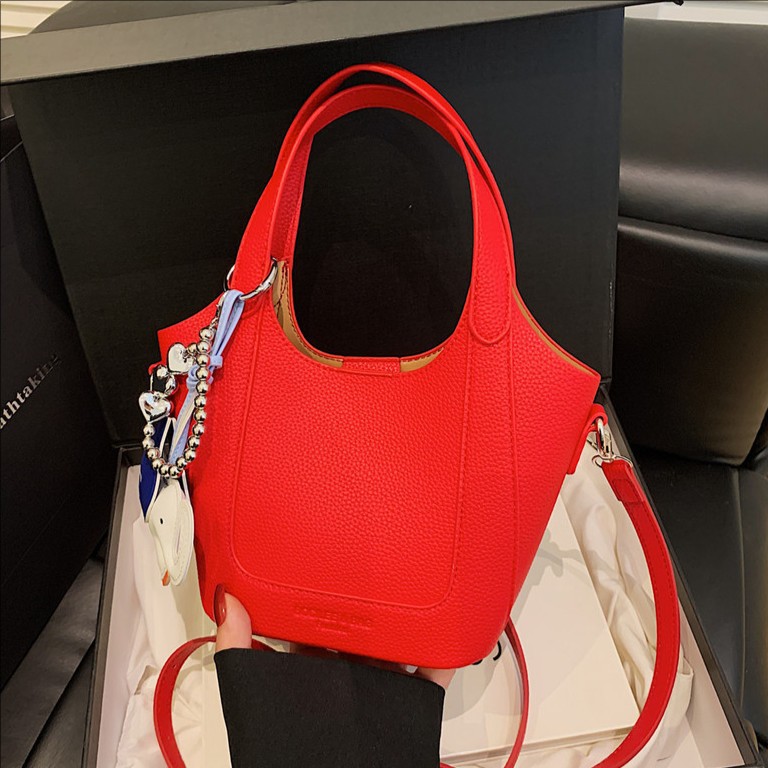 High-end texture simple hand-held bucket bag for women, 2025 new Spring/Summer Korean style fashionable retro single-shoulder crossbody bag full figure