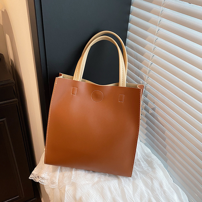 A popular vertical women's bag, 2025 new style, Korean style trendy commuting bag, large-capacity hand-held tote bag full figure