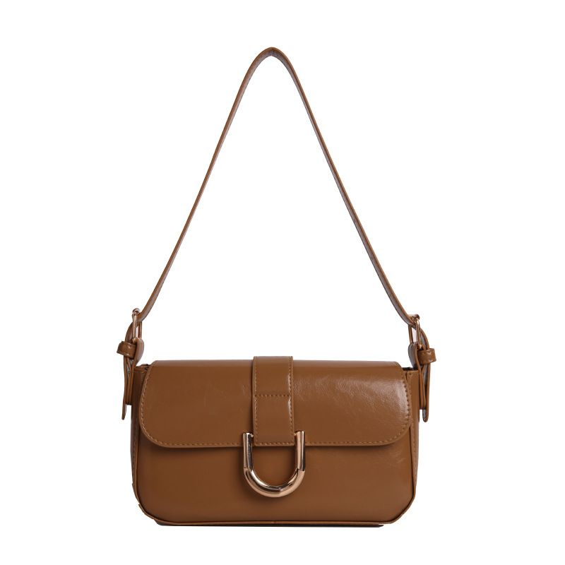 The wine-red bag exudes a retro and high-end vibe. It's a fashionable shiny leather hand-held underarm bag and a trendy and individual single-shoulder crossbody bag Item Picture