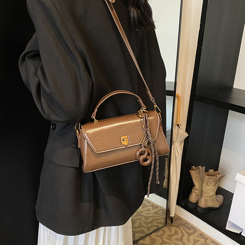 This year, the oil wax leather small bags for women are in vogue. The 2025 new style is a high-end hand-held small square bag and a retro casual crossbody bag Application Scenario