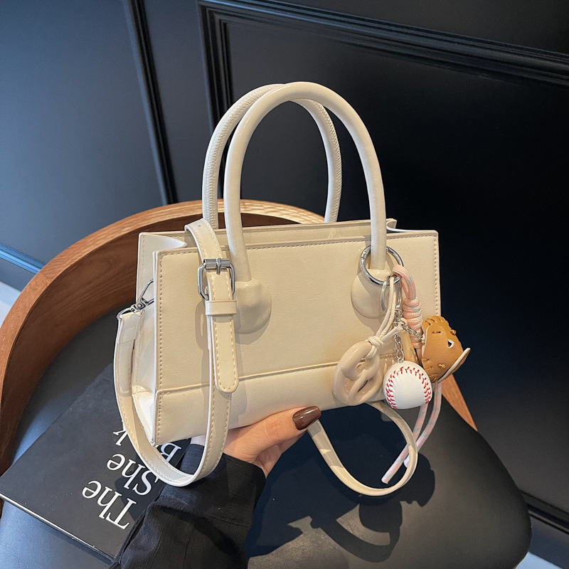 The Korean style Instagram simple and stylish small bag for women 2025, a new hand-held small square bag, is fashionable and versatile for commuting crossbody full figure