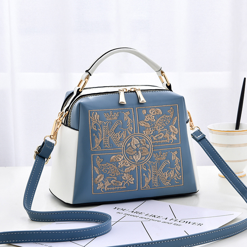 The 2022 new style of fashionable embroidered middle-aged women's handbag is stylish and can be worn diagonally over one shoulder full figure