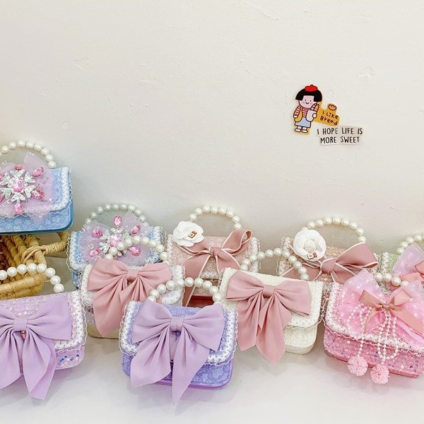 Autumn and winter Korean version bow camellia children's bag Pearl hand-held lace trim kindergarten girl crossbody bag full figure