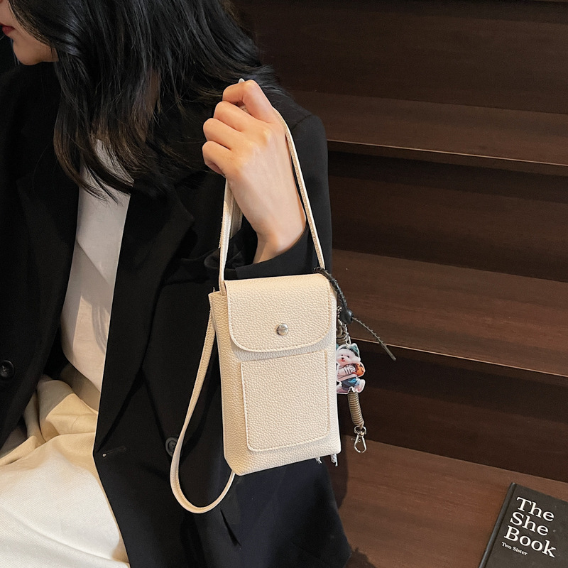 The 2025 new vertical fashion bag with lychee pattern and soft leather texture is a versatile and portable phone bag for walking details Picture