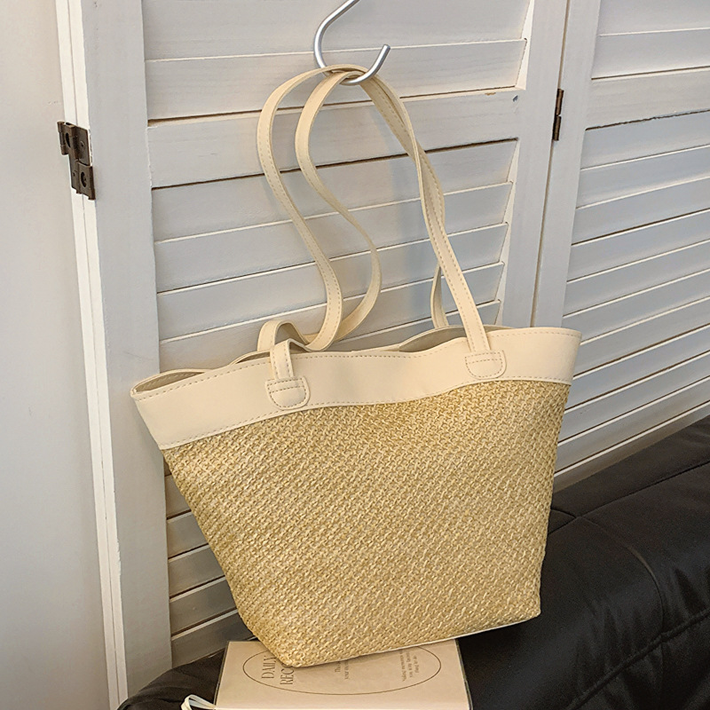 The 2024 new summer woven crossbody bucket bag with a unique design for women and a fashionable hollowed-out beach bag full figure