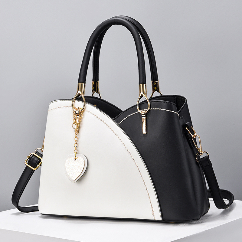 The 2022 new color-blocked fashionable commuter women's bag, a trendy single-shoulder, crossbody, hand-held tote large bag for cross-border trade full figure