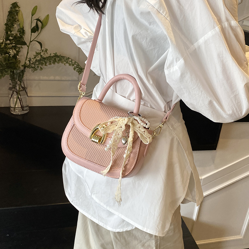 This is a new, stylish and versatile single-shoulder crossbody saddle bag for women in 2025, featuring a light luxury and niche woven handbag details Picture