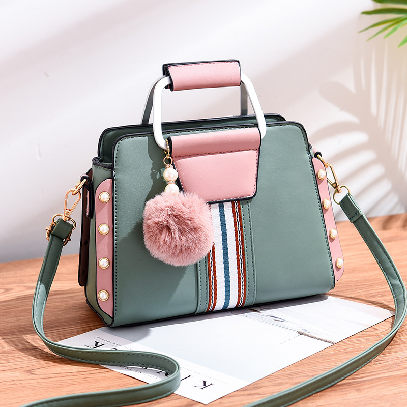 Cross-border trade color-matched women's bags are trendy, versatile and stylish. Bright-colored bags come with hairball pendants and can be worn diagonally over one shoulder full figure