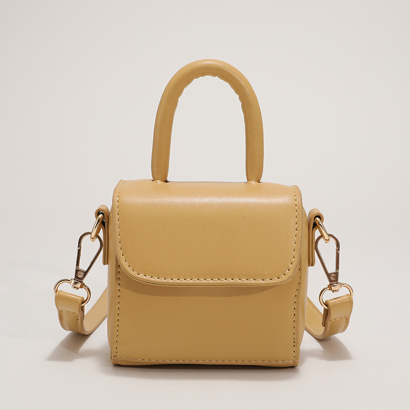 New fashionable Korean version solid-color hand-held small square bag, chocolate-colored children's hand-held crossbody lipstick bag, women's bag Item Picture