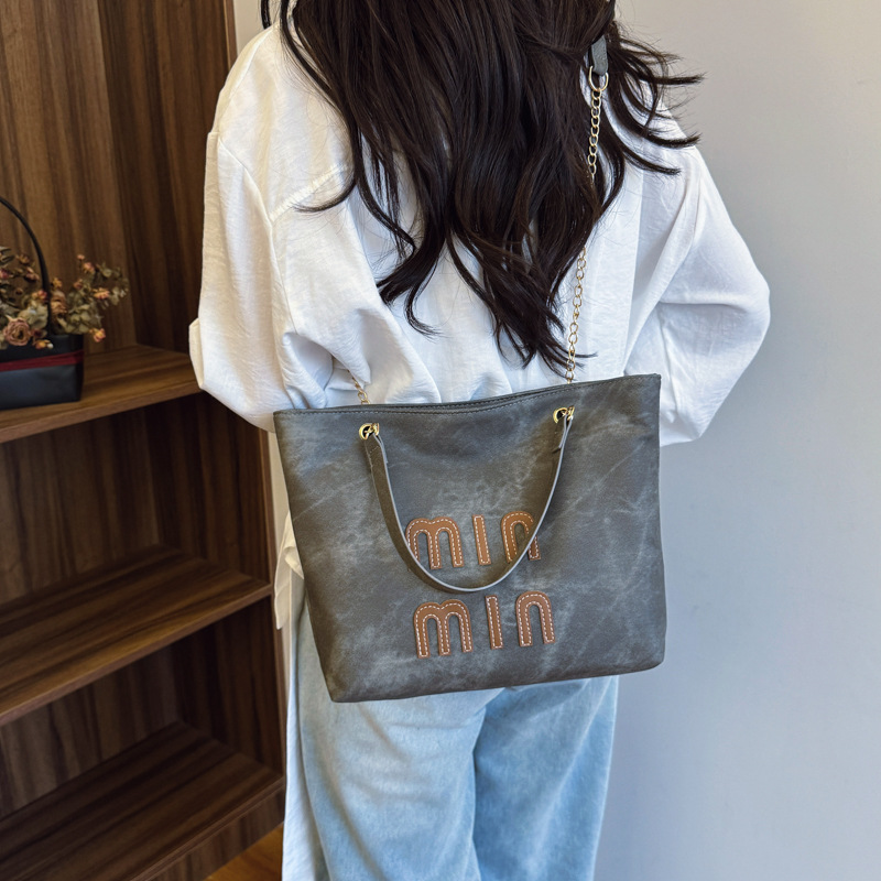 Cross-border Women's Bag 2025 New large-capacity milk pattern fashionable hand-held shoulder bag, crossbody bag, commuter women's bag details Picture