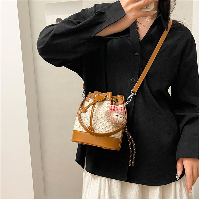 This is a new summer version of the straw woven women's bag for 2025. It features a niche design, fashionable and retro woven drawstring bucket bag, and is a versatile crossbody bag details Picture