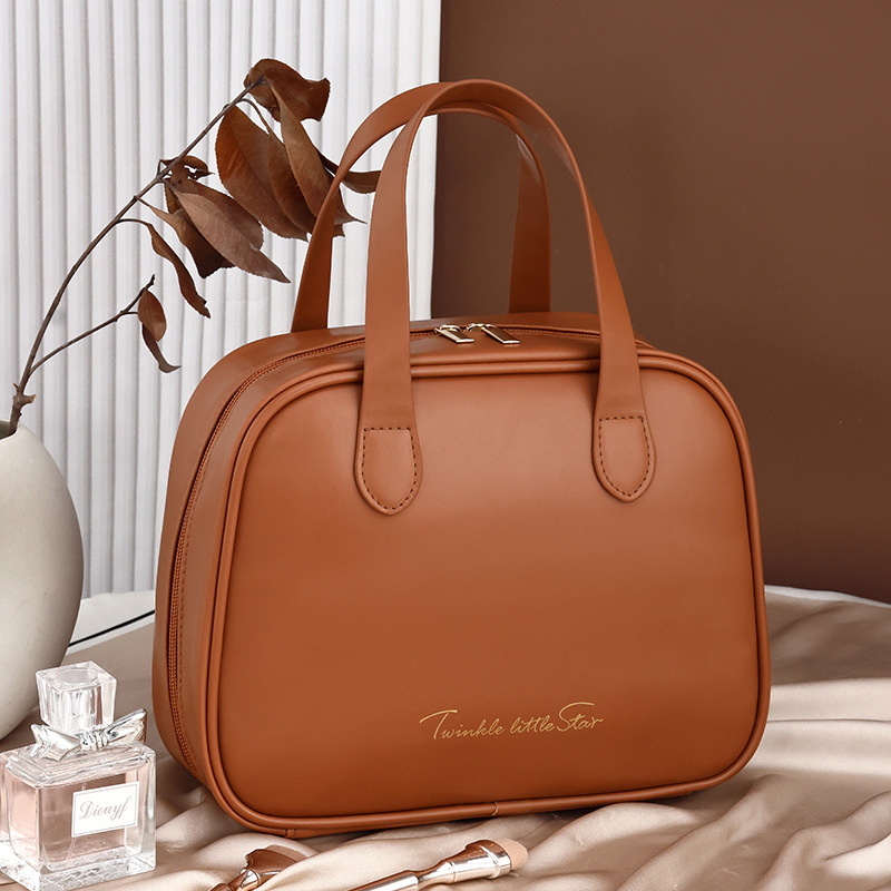 A large-capacity, InS-style, high-end, high-appearance-level hand-held makeup bag with a half-bend design, zoned storage, and a large storage bag full figure