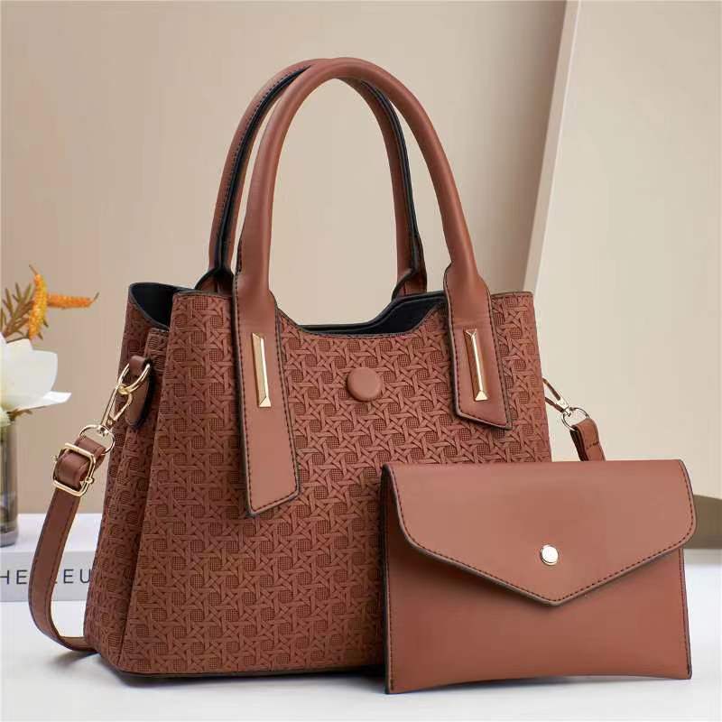 The 2024 new style of embossed women's handbag for foreign trade is simple, elegant, fashionable and stylish. It is a single-shoulder crossbody women's bun mother bag details Picture