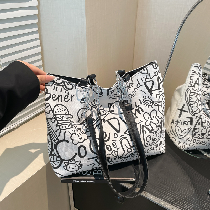Simple commuting large-capacity bag, women's fashion graffiti tote bag, 2025 new summer niche casual single-shoulder bag full figure