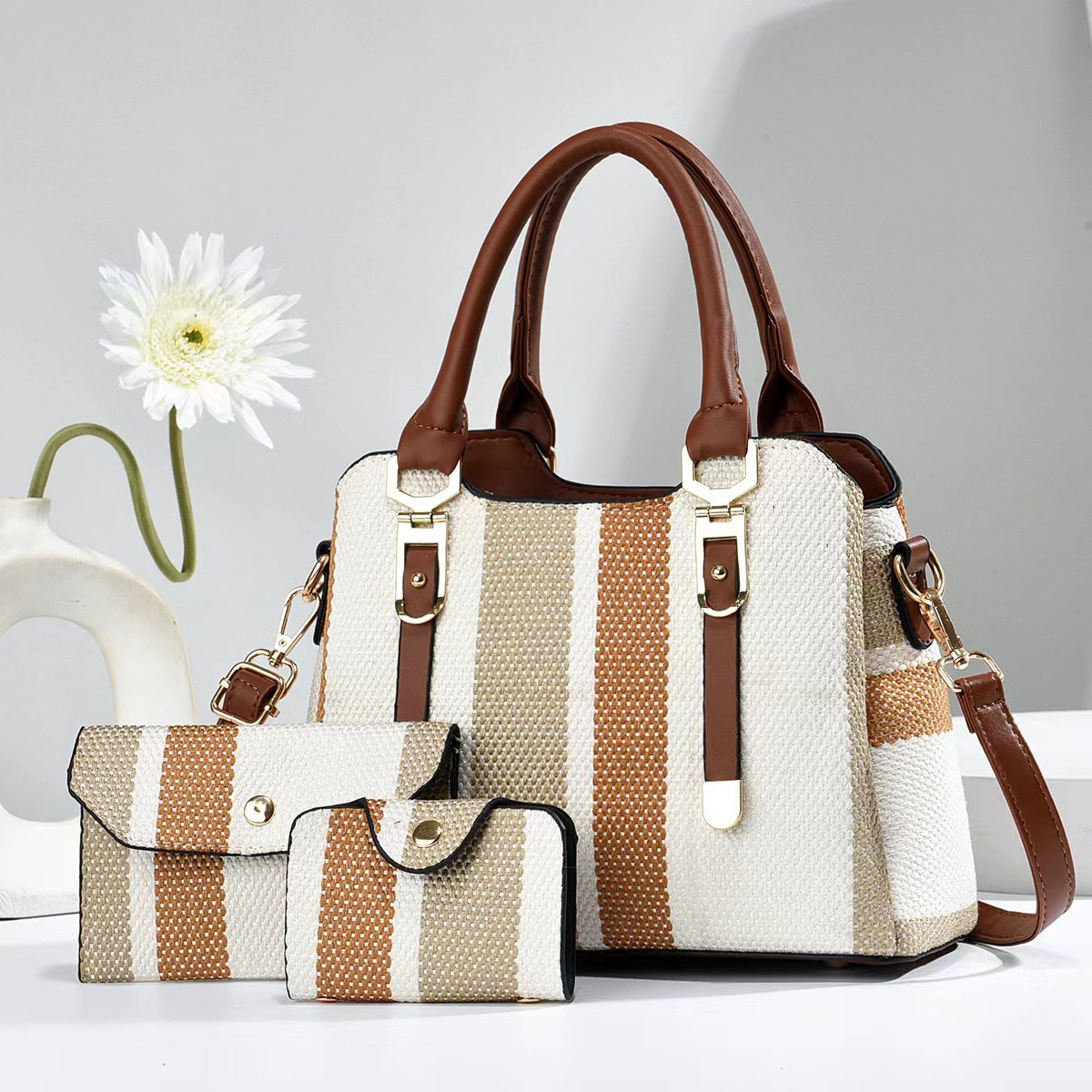 The new Spring/Summer 2024 stylish large-capacity handbag with checkered fabric for export, featuring a color-blocking vertical stripe single-shoulder crossbody bag, is a trend full figure