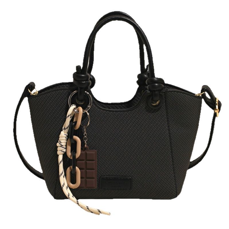 A trendy and fashionable hand-held bucket bag for women in 2025, featuring a high-end commuting look with woven patterns and a single-shoulder crossbody design Item Picture