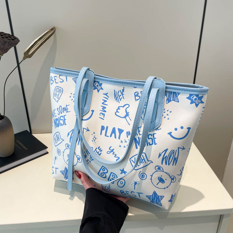 The new cute cartoon printed single-shoulder bag for women in the 2024 autumn and winter season is a versatile and trendy tote bag full figure