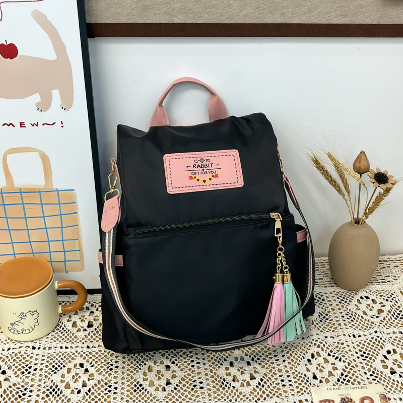 The 2025 summer new fashion college student backpack is simple and versatile, a large-capacity multi-functional crossbody bag for commuting full figure