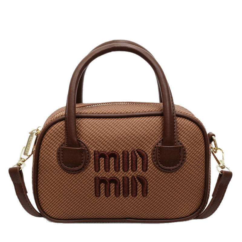 The 2025 summer new high-end retro hand-held Boston bag is a versatile and fashionable single-shoulder crossbody bag with contrasting colors for women Item Picture