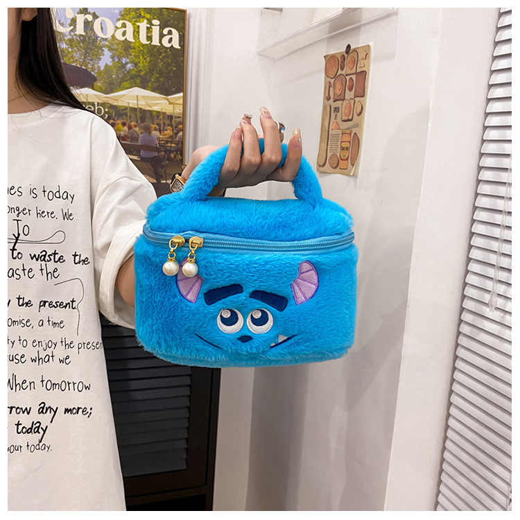 Claw machine makeup bag storage bag, large-capacity portable student cartoon hand-held travel toiletries and makeup bag gift details Picture