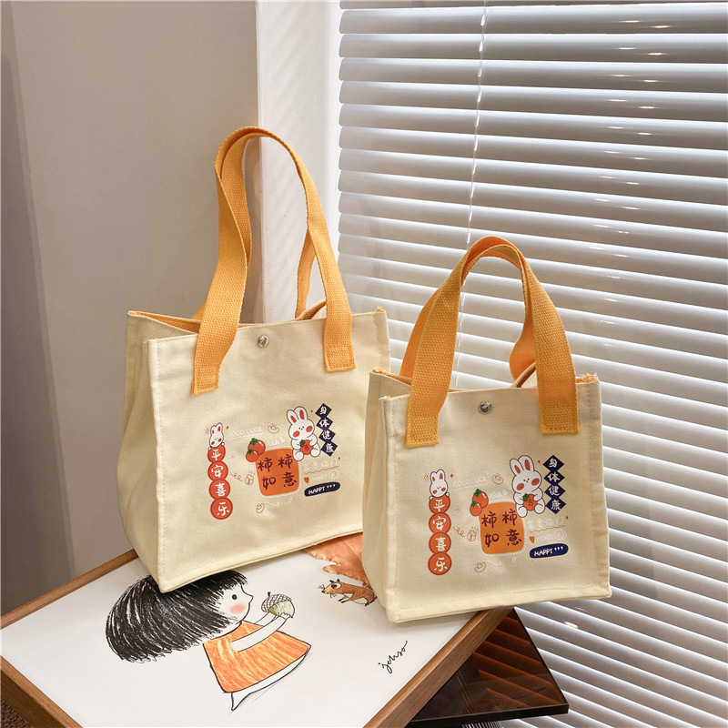 2024 New single-shoulder crossbody cute little rabbit hand-held bento bag, student canvas hand-held supplementary class fresh and sweet bag full figure