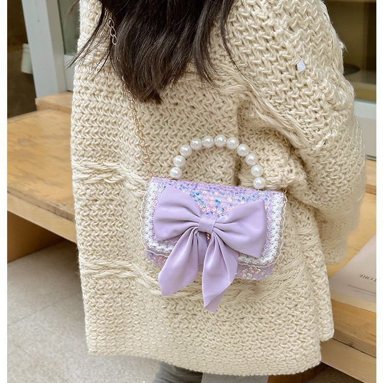 Autumn and winter Korean version bow camellia children's bag Pearl hand-held lace trim kindergarten girl crossbody bag Application Scenario