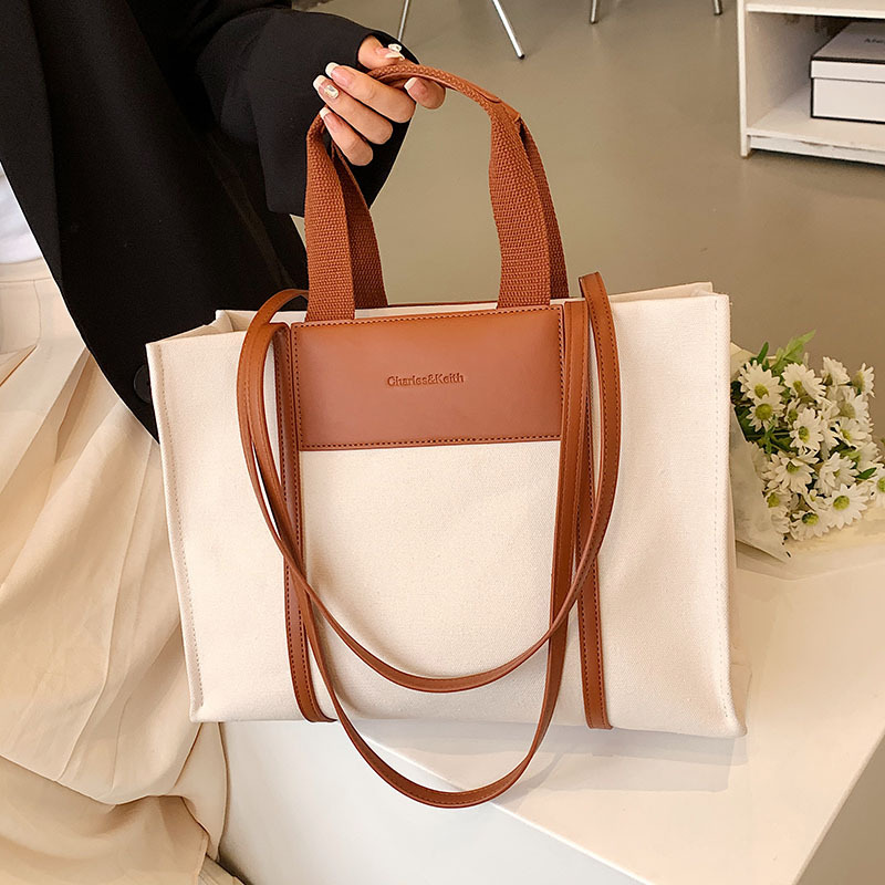A new 2025 fashionable and casual canvas bag, a large hand-carry bag for university commuting, a versatile and trendy women's large-capacity tote bag Application Scenario