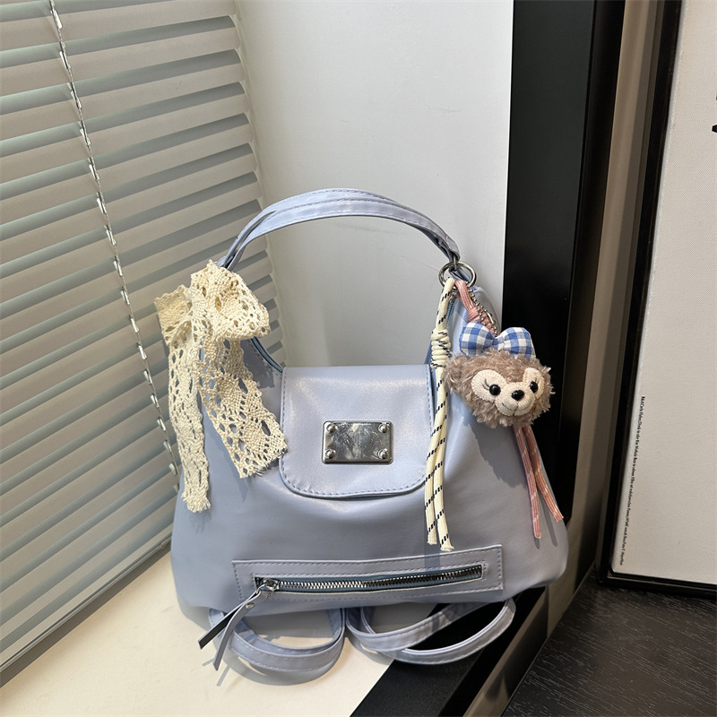 The 2025 new large-capacity college-style backpack is a versatile tote bag for women's daily commuting and a retro niche crossbody bag full figure