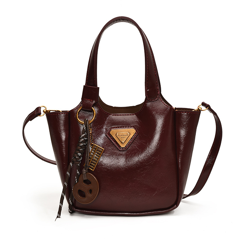 The 2024 new style of fashionable hand-held bucket bag is a high-end, casual and versatile single-shoulder bag with a retro and niche design for women Item Picture