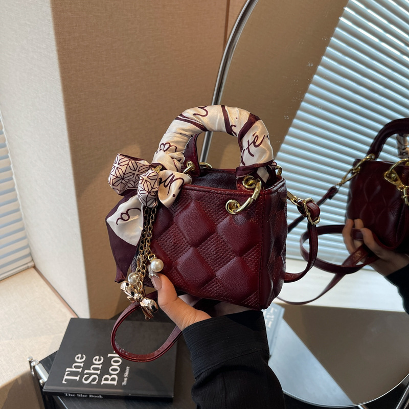 A trendy and fashionable mini handbag designed for women in 2025, a versatile crossbody bag with a red envelope opening details Picture