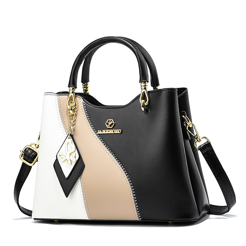 This is a new high-end Korean-style trendy handbag for women in spring 2024. It features a sweet and elegant style with a color-blocking design and a crossbody bag Specification drawing