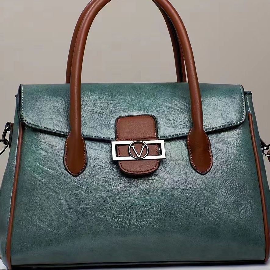 A new Korean-style stylish commuter women's bag for foreign trade, with a large capacity, fashionable and simple design, hand-held shoulder, and a soft leather-like tote bag Item Picture