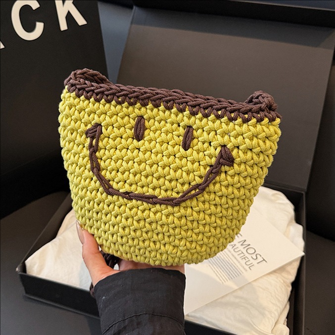 2025 New style simple bucket bag, niche women's bag, smiling knitted bag, single-shoulder bag for going out, and crossbody bag for seaside travel full figure