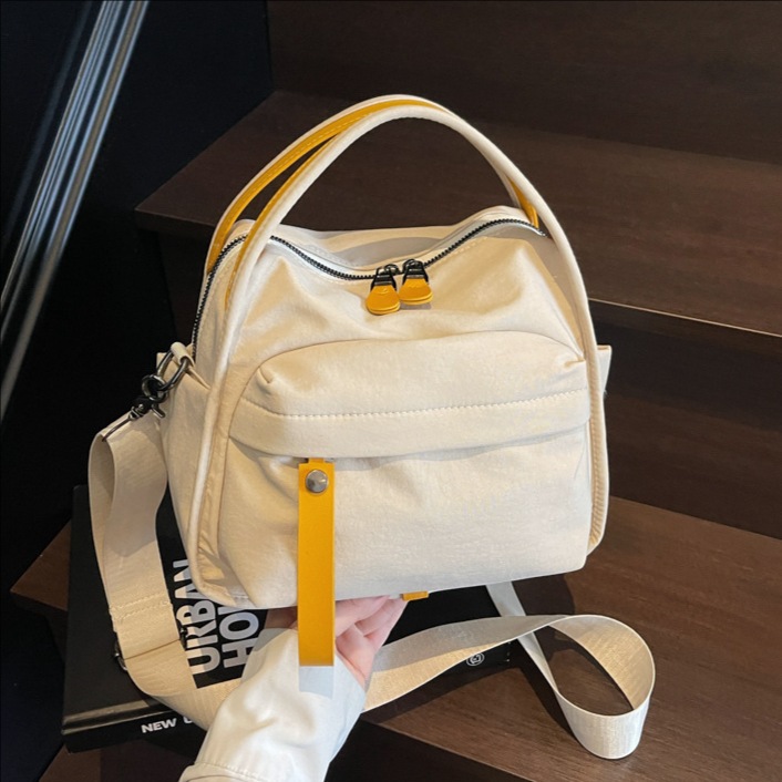 2025 New simple, lightweight, casual, fashionable and versatile handbag for women, solid color commuting multi-pocket single-shoulder crossbody bag full figure