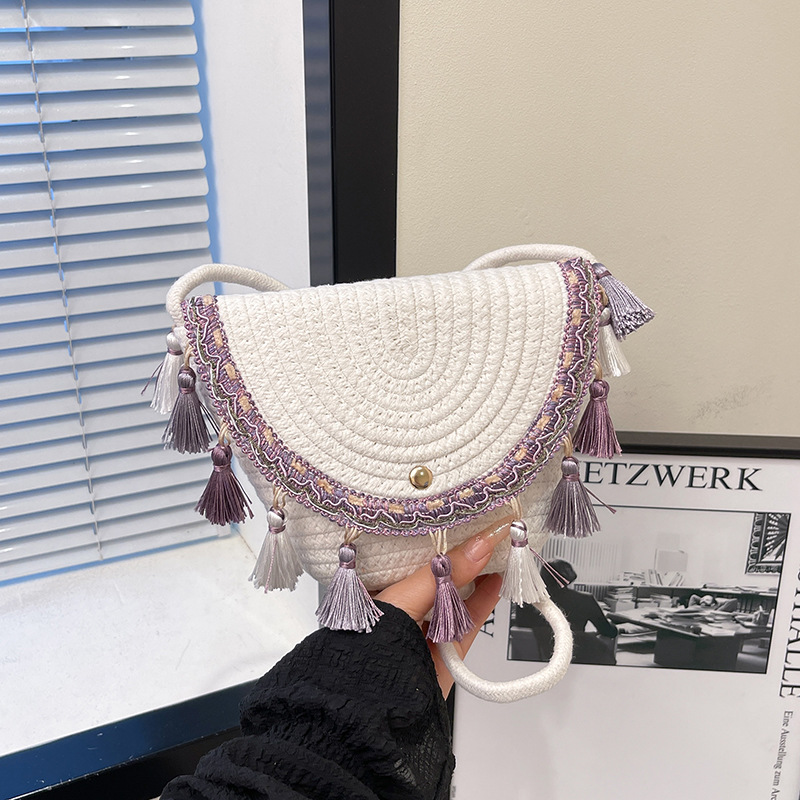 Spring 2025 new straw woven bag, fringed texture saddle bag, vacation style woven bag, single-shoulder crossbody women's bag full figure