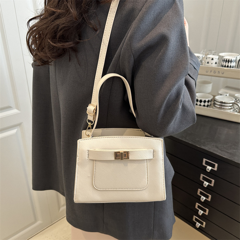 The 2025 new trendy commuter handbag with a lychee pattern, a fashionable, simple and niche single-shoulder bag and crossbody bag details Picture