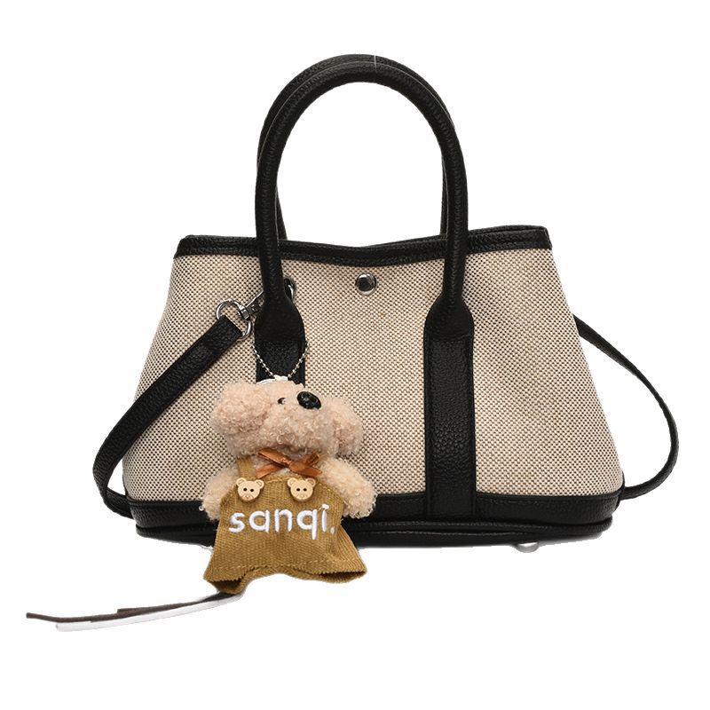 The 2025 new stylish color-blocking large-capacity hand-held bucket bag is a simple, casual and versatile commuter single-shoulder crossbody bag for women Item Picture