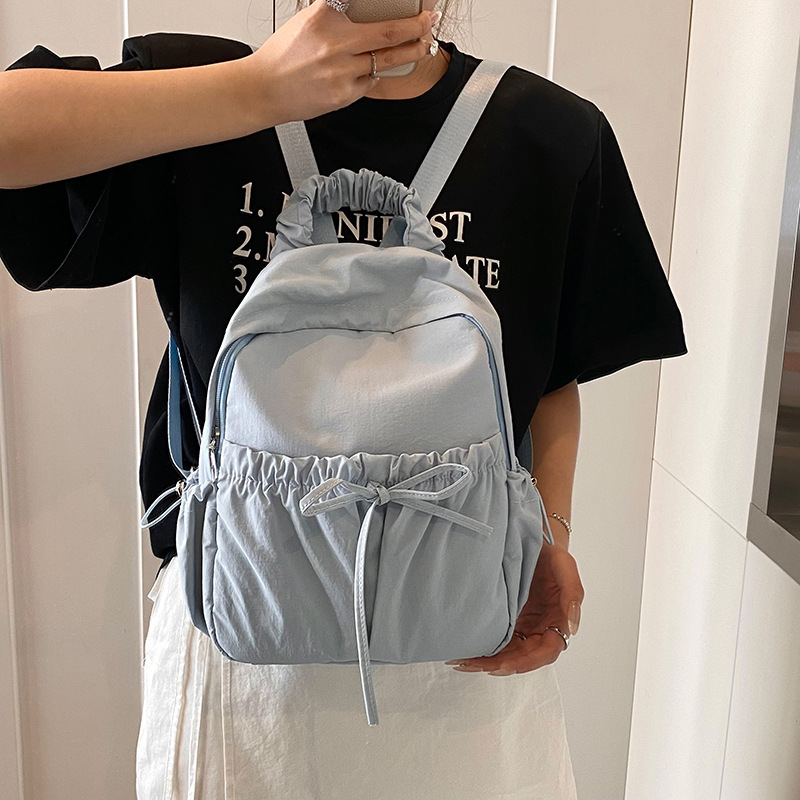 The 2025 new Korean-style niche nylon backpack is a lightweight and versatile travel and outdoor backpack with a large capacity for students details Picture