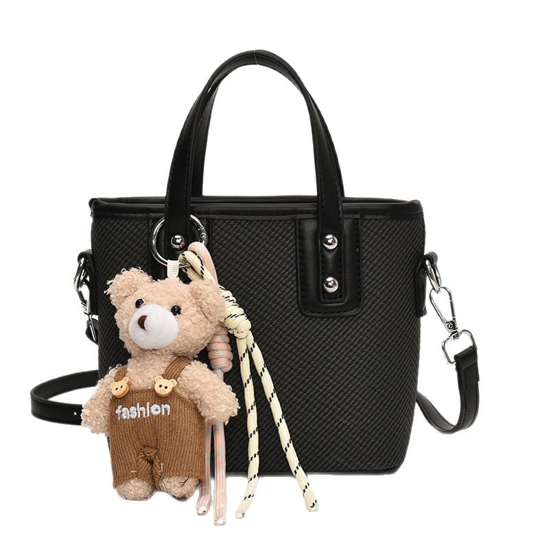 Korean high-end solid color hand-held bucket bag for women, new Spring/Summer 2025 trendy and fashionable commuting single-shoulder crossbody bag Item Picture